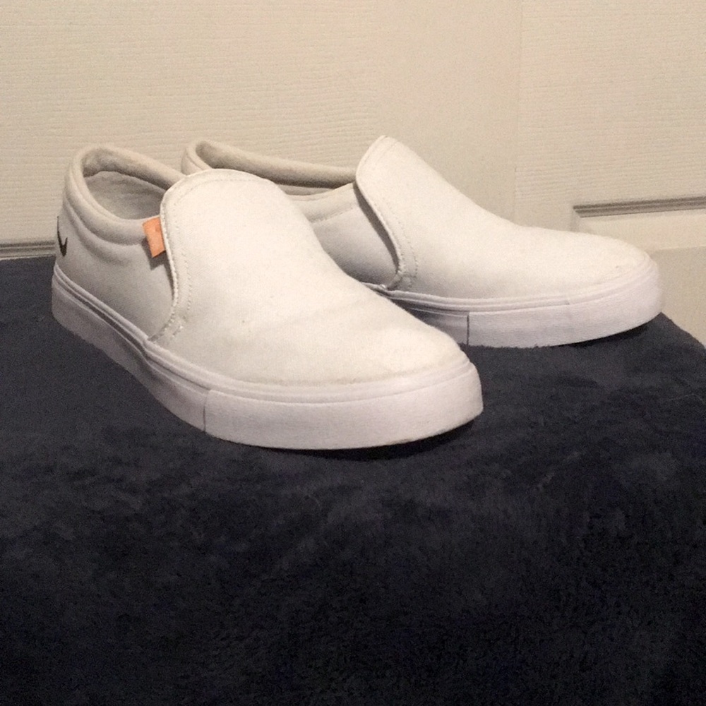 White nikes , size 7 slip one